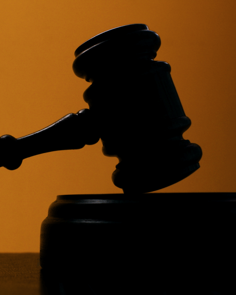 low-lit image of a judge's gavel