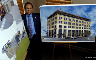 Developer Ray Marshall poses with two projects